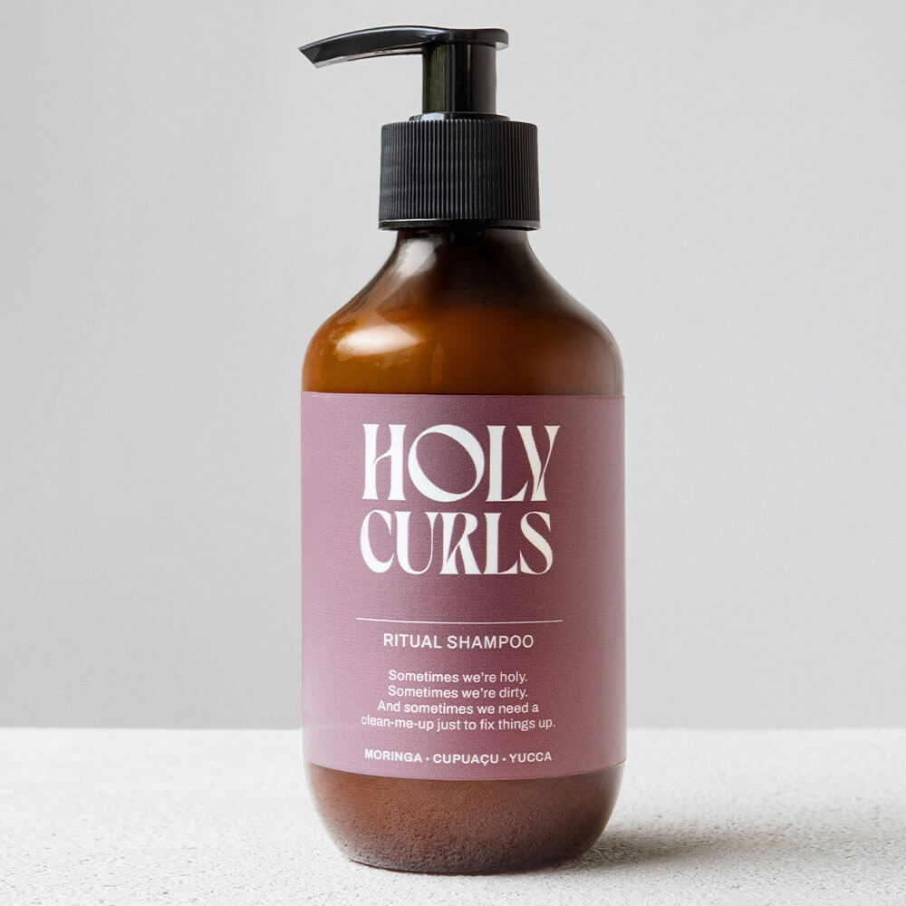 Bottle of 'Holy Curls' Ritual Shampoo on a light background