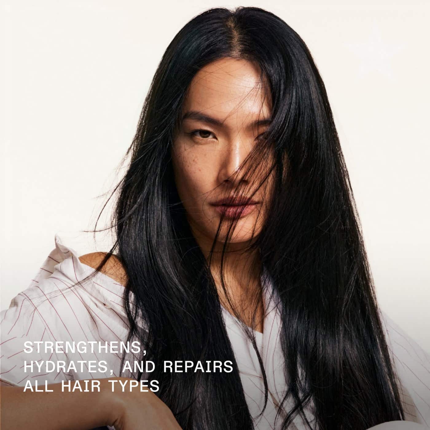 Person with long black hair against a white background, with text about hair care products.