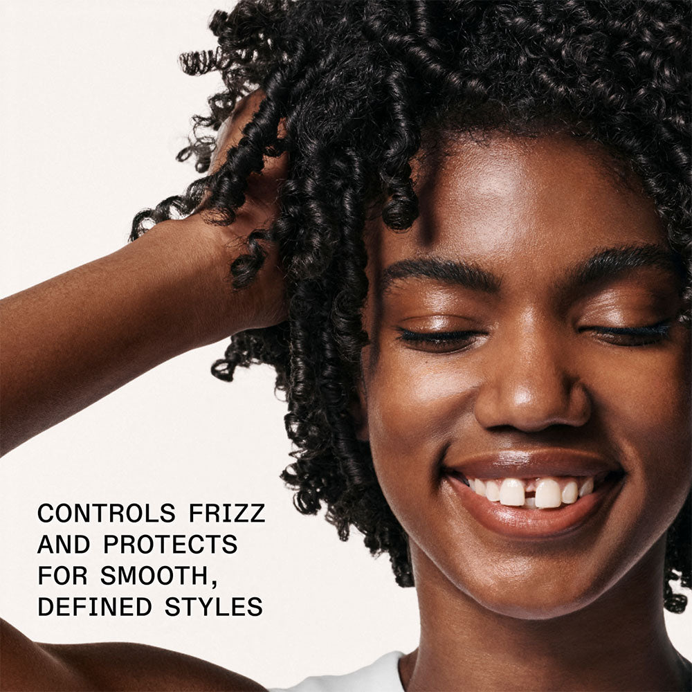black Olaplex model with curly hair