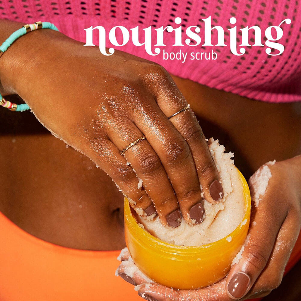 Person using a nourishing body scrub with text overlay