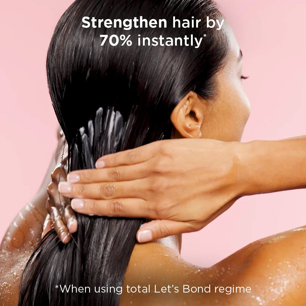 Woman washing her hair with a pink background and text about hair strength.