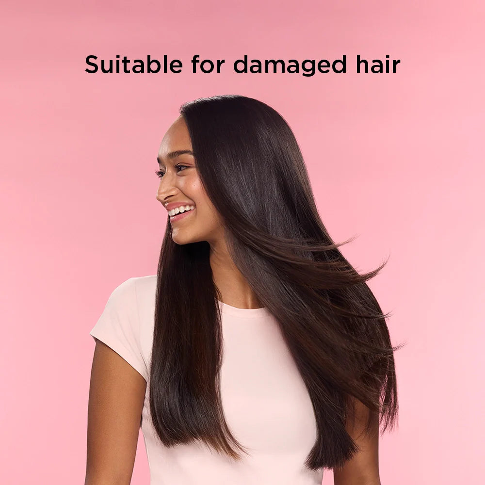 Woman with long, straight hair on a pink background with text 'Suitable for damaged hair'.