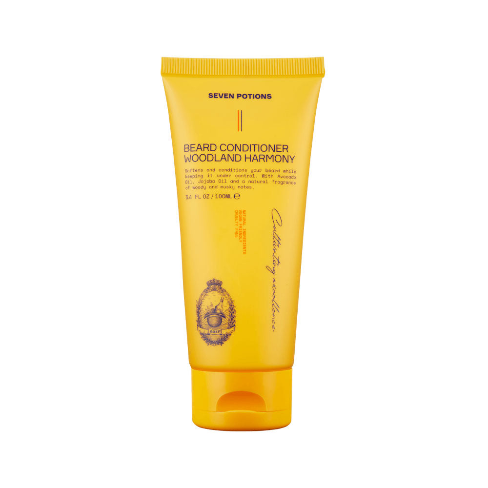 Yellow tube of 'Seven Potions' beard conditioner on a white background
