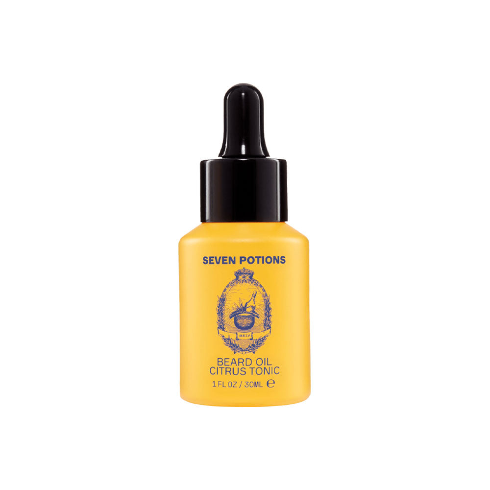 Yellow bottle of Seven Potions beard oil with a black dropper on a white background