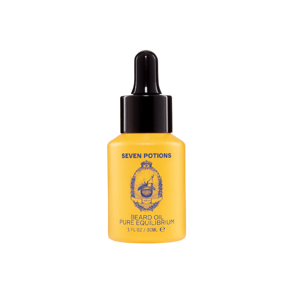 Yellow bottle of Seven Potions beard oil on a white background