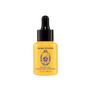 Yellow bottle of Seven Potions Woodland Harmony beard oil on a white background