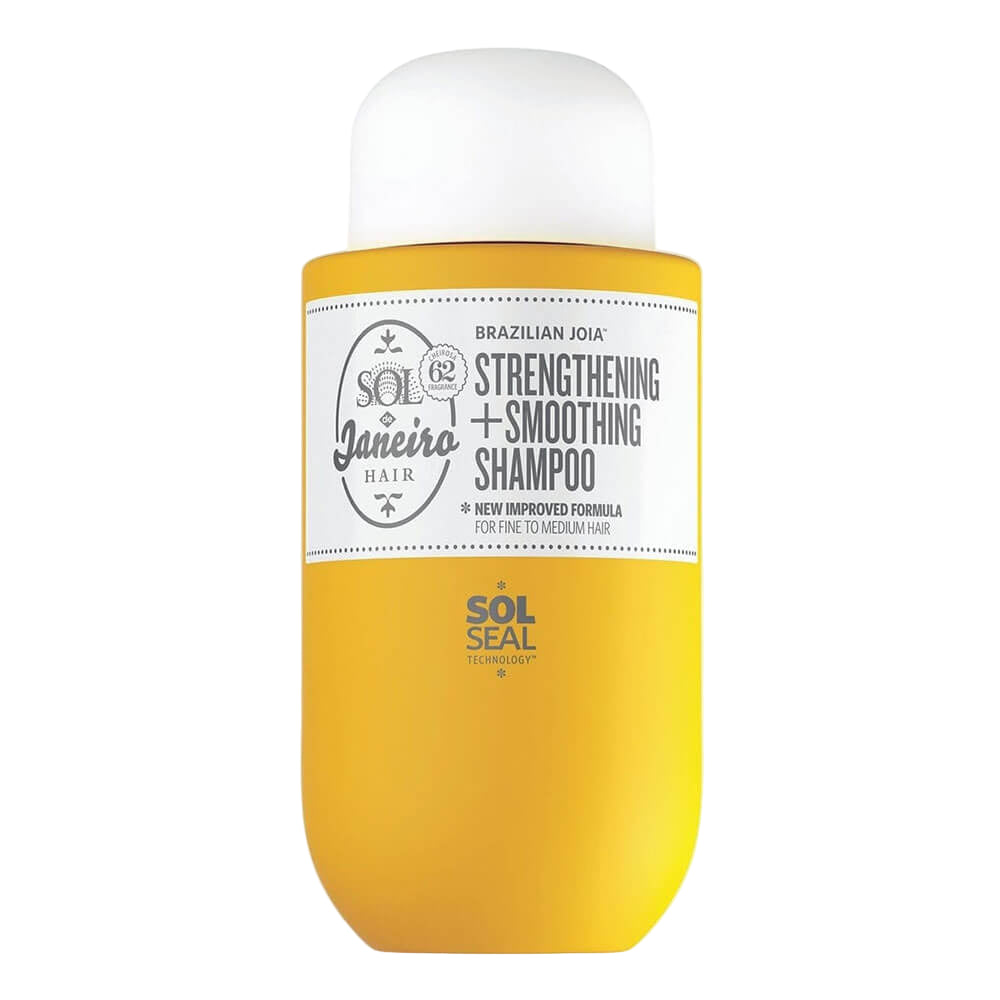 Yellow shampoo bottle with white cap on a white background