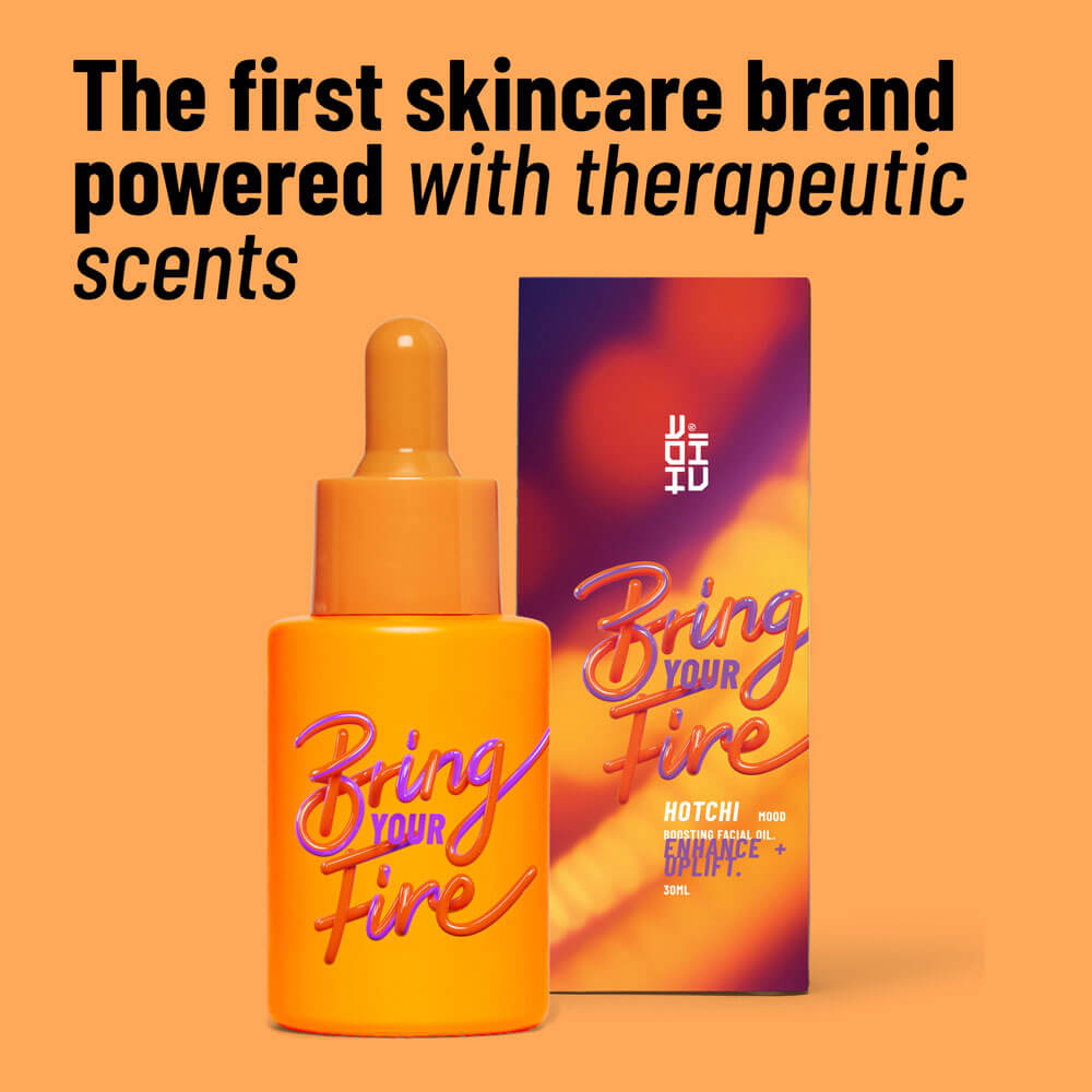 Orange skincare bottle and packaging with 'Bring Your Fire' text on an orange background