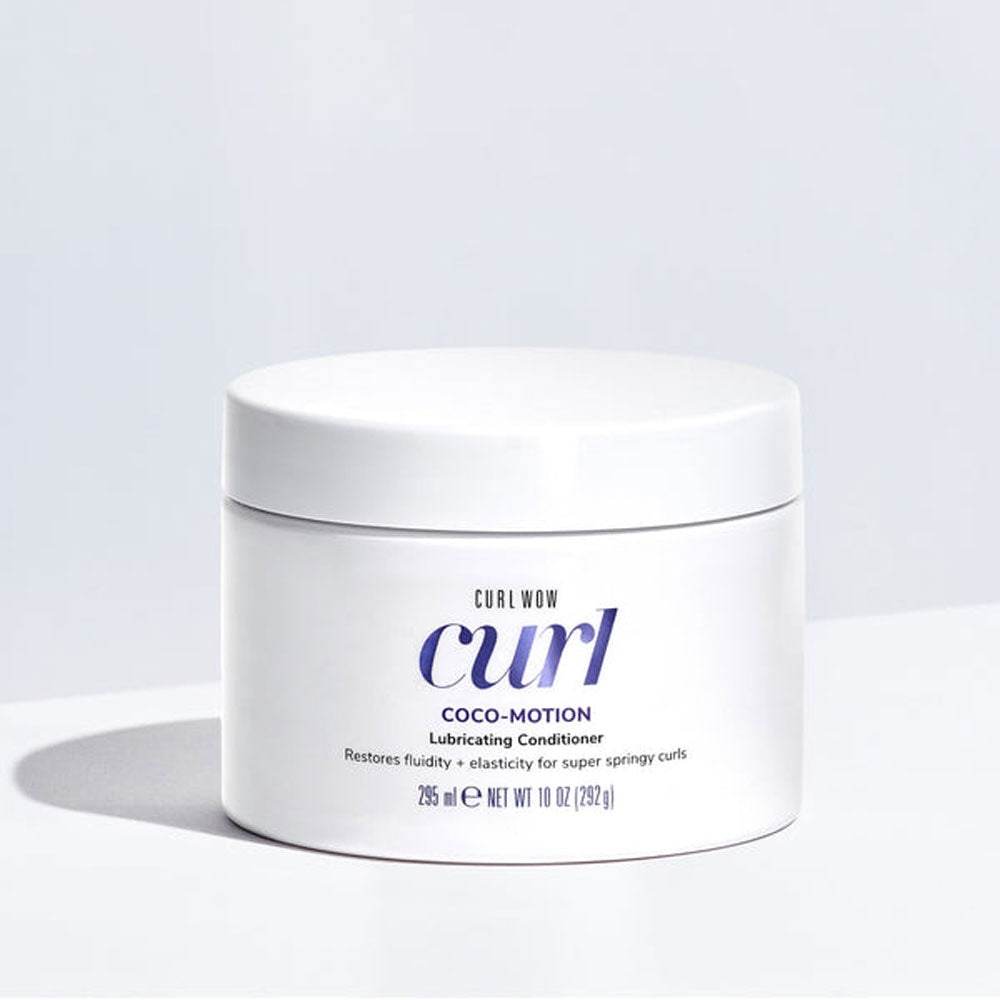 Jar of Curl Wow Coco-Motion Lubricating Conditioner on a light gray background
