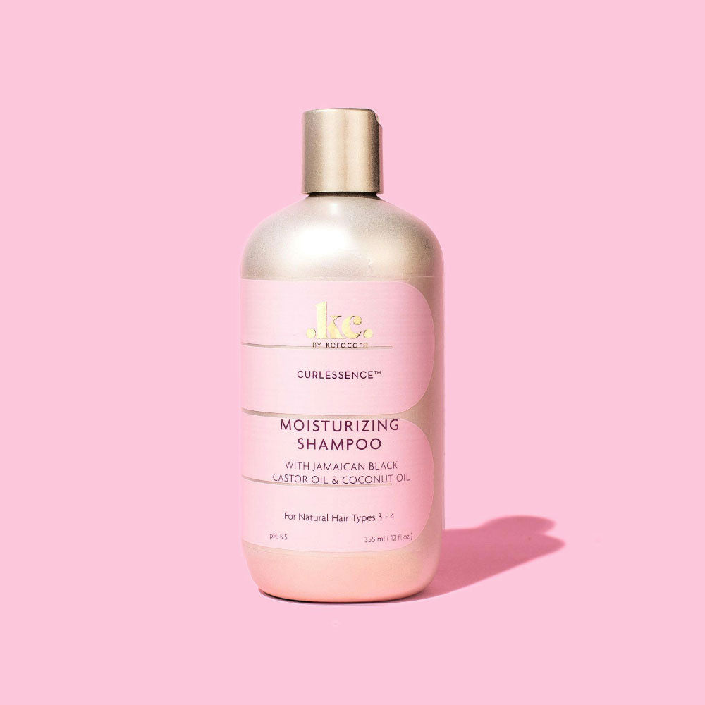 Moisturizing shampoo bottle on a pink background