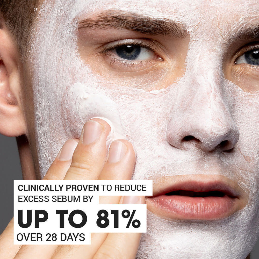 Person applying a face mask with text claiming clinical effectiveness on a gray background