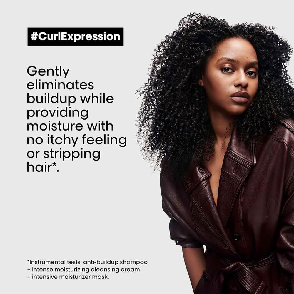 Woman with curly hair wearing a brown leather jacket, with text about hair care products.