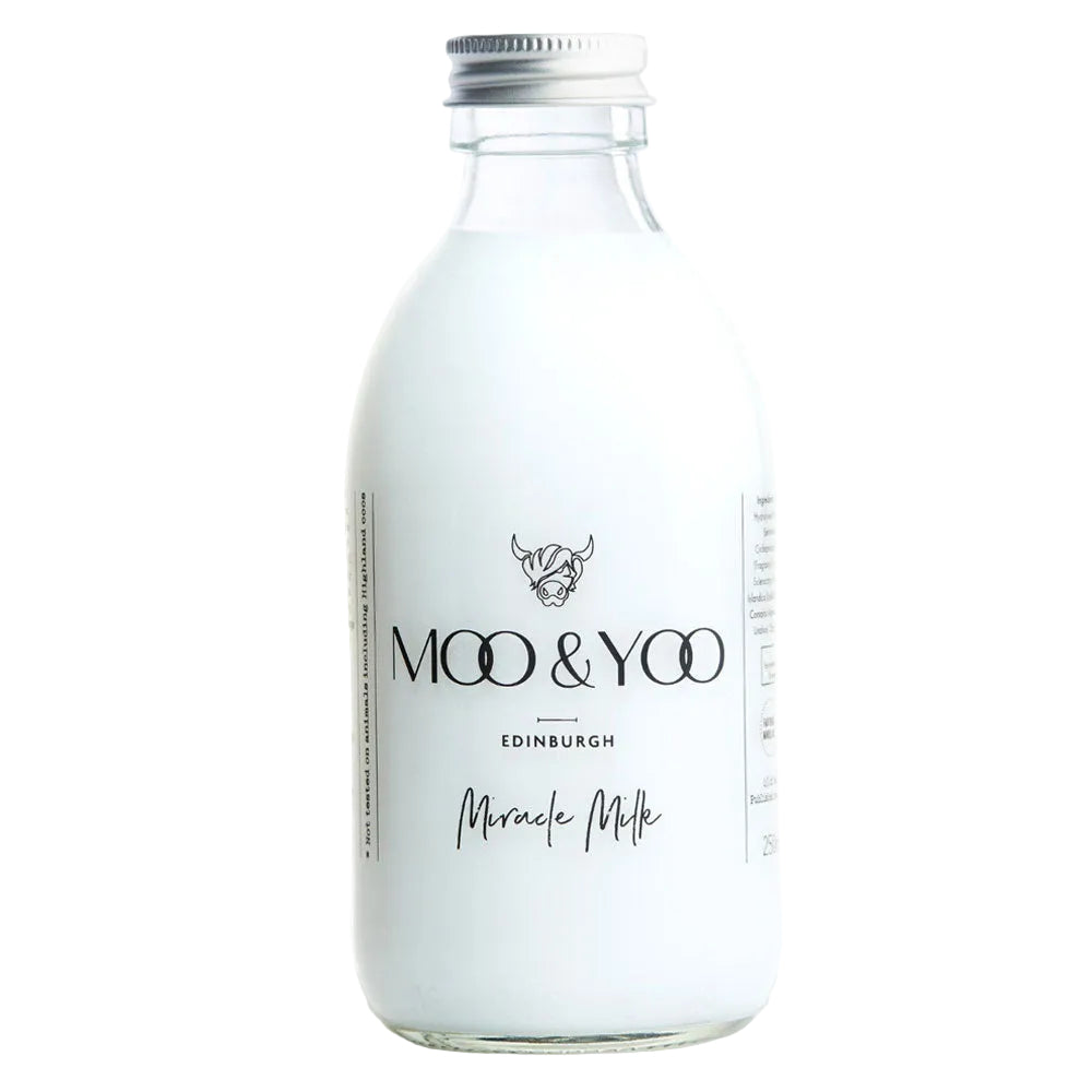 Glass bottle of 'Moo & Yoo Edinburgh Miracle Milk' on a white background