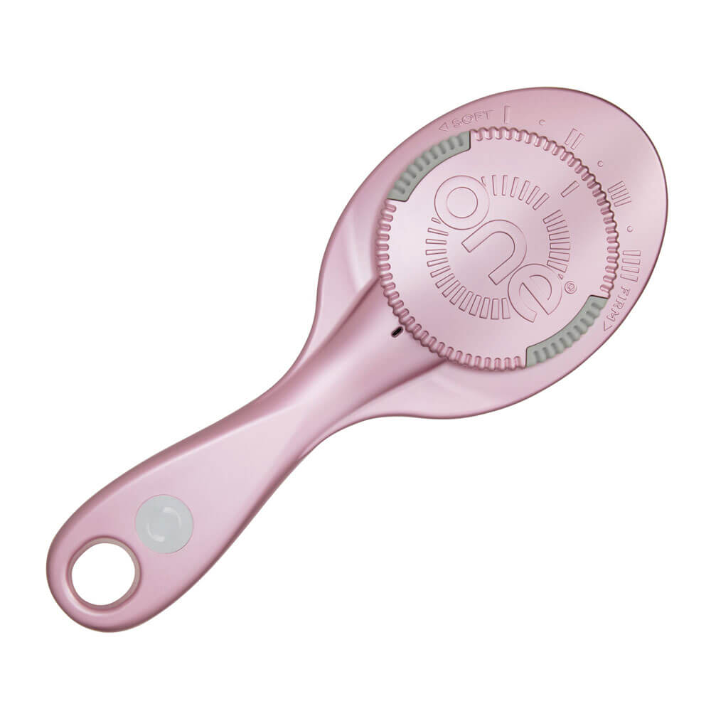 Pink hair brush with a brand logo on a white background