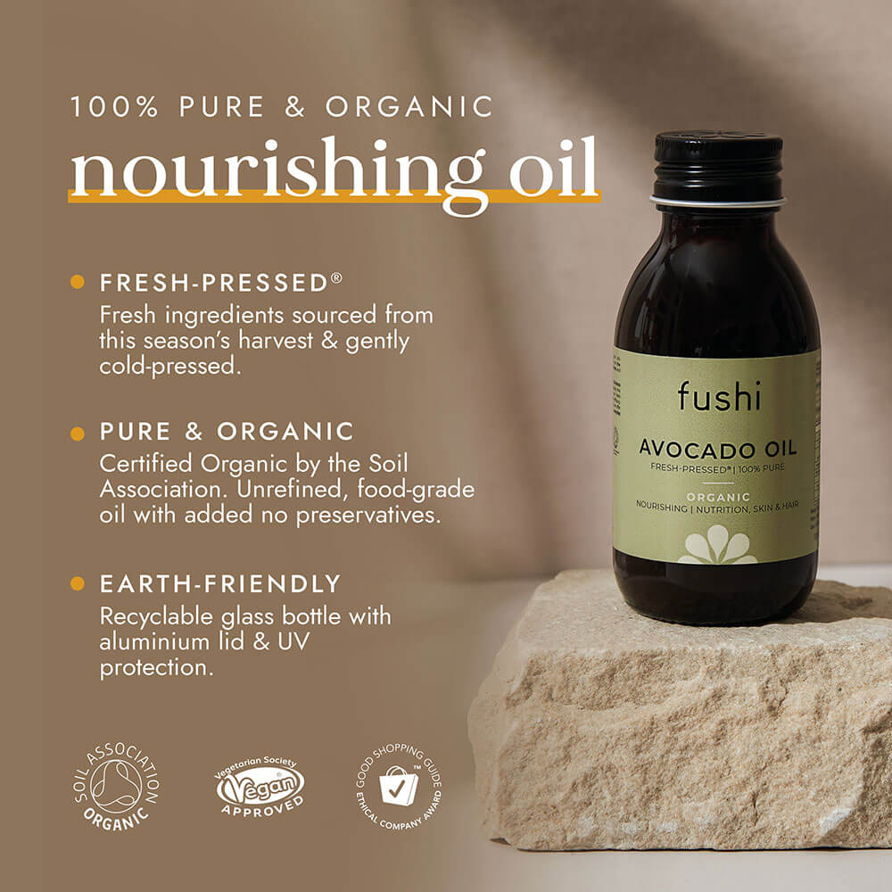 Fushi avocado oil bottle on a stone surface with product details and certifications.