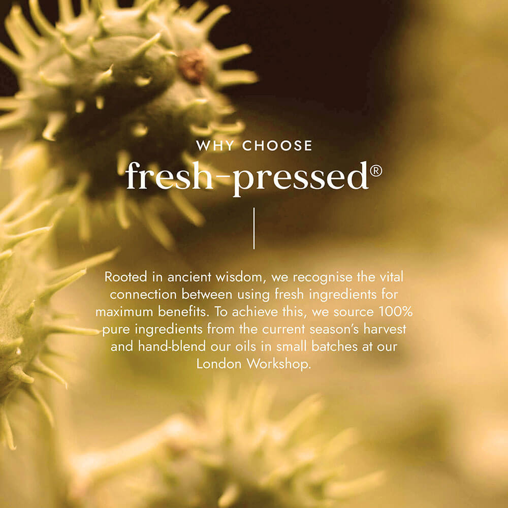 Close-up of a plant with text about choosing fresh-pressed products, set against a blurred natural background.