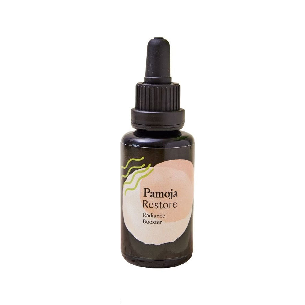 Bottle of Pamoja Restore Radiance Booster on a white background