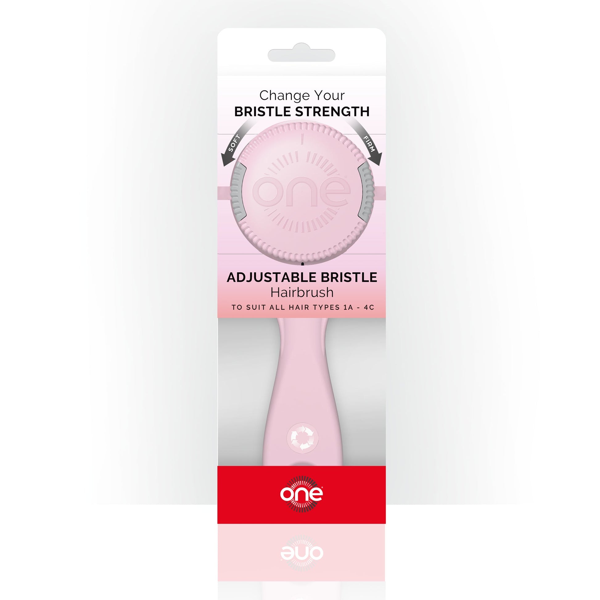 Pink adjustable bristle hairbrush in packaging with 'one' branding