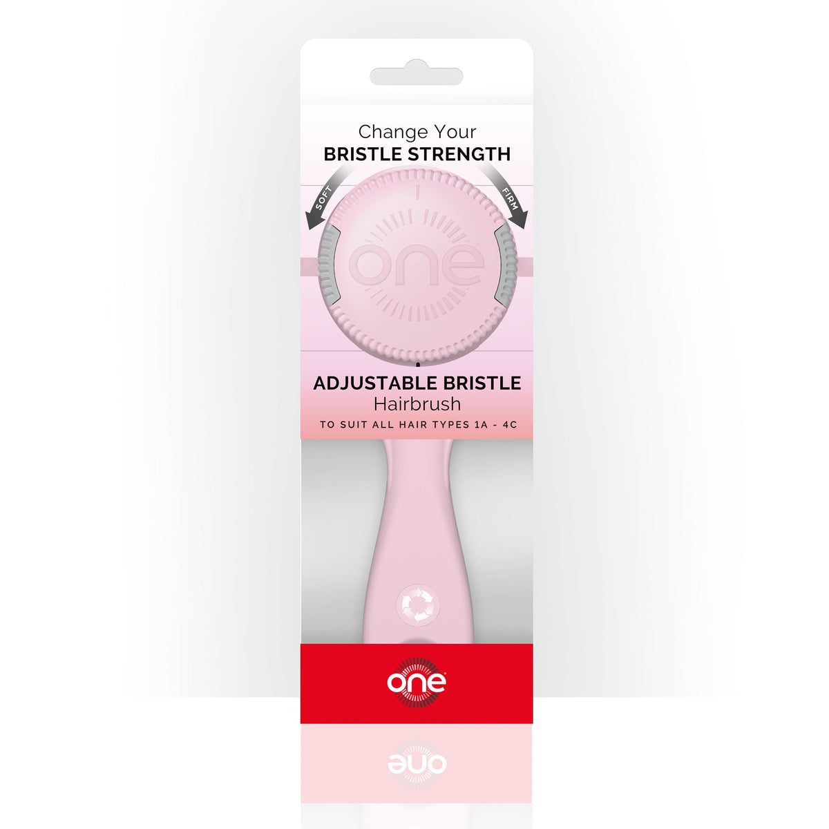 Pink adjustable bristle hairbrush in packaging with 'one' branding