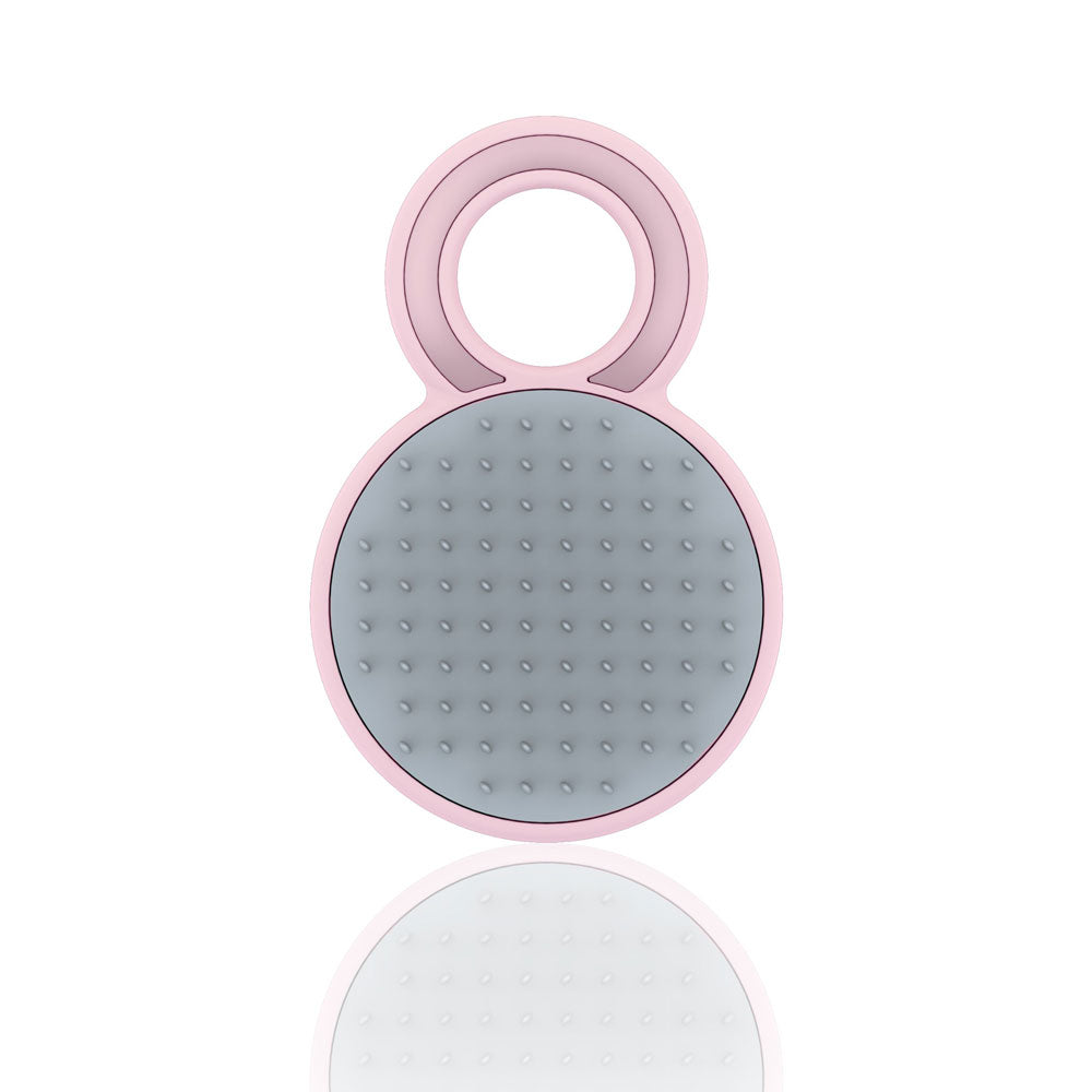 Pink and gray grooming tool on a white background