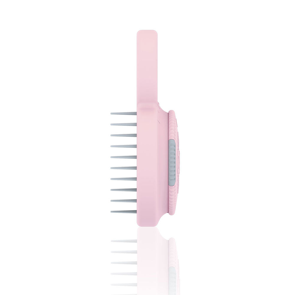 Pink grooming comb on a white background