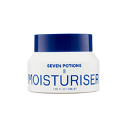 A white jar of Seven Potions Moisturiser with a dark blue lid, featuring blue text and a small French flag detail on the front label, set against a plain white background.