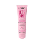 Pink shampoo bottle labeled 'Noughty Let's Bond' on a white background