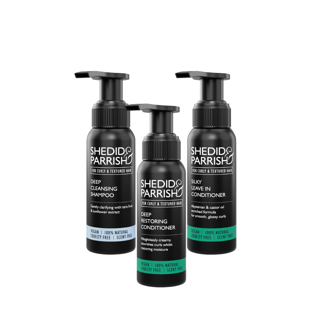Three bottles of Shedid Parrish hair care products on a white background