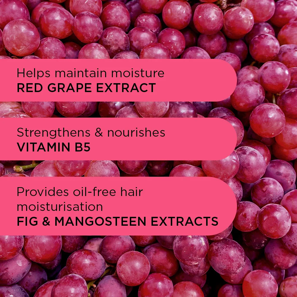 Red grapes with text about hair care ingredients on a pink background