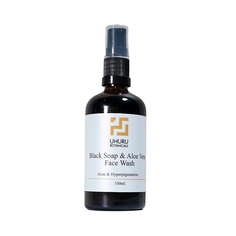 Bottle of Uhuru Botanicals Black Soap & Aloe Vera Face Wash on a white background