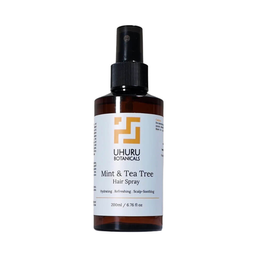 UHURU Botanicals Mint & Tea Tree Hair Spray bottle on a white background