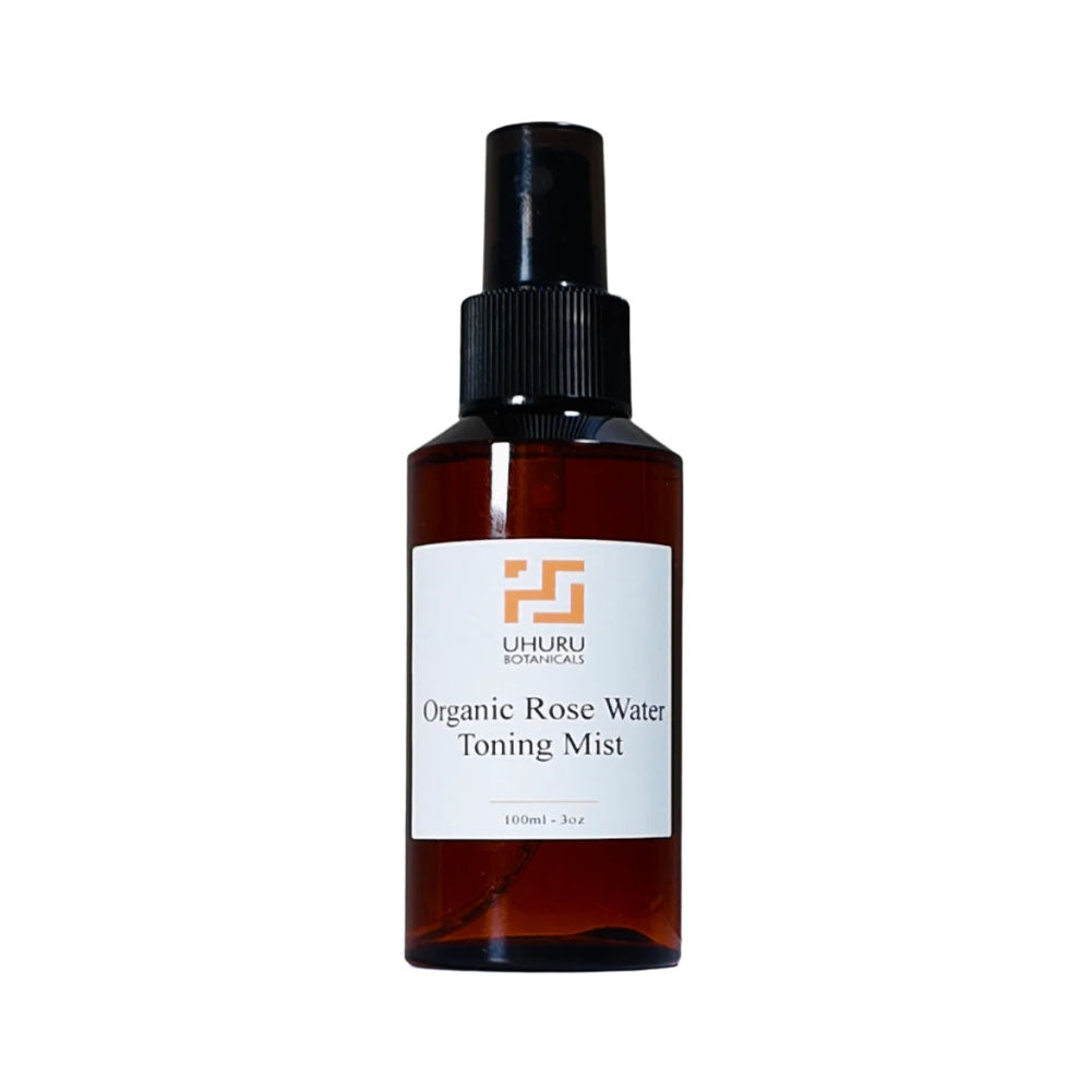 Organic Rose Water Toning Mist bottle with a white label on a white background