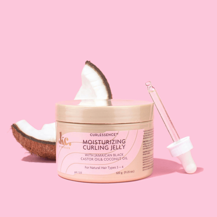 Jar of Curlessence moisturizing curling jelly with a scoop on a pink background