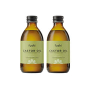 Two bottles of fushi Castor Oil on a white background