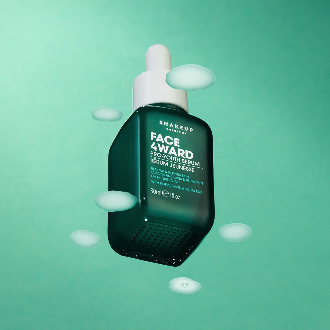Shakeup Face Award serum bottle on a green background