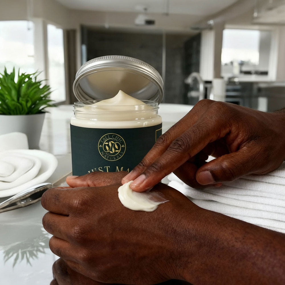 Person applying cream from a jar labeled 'Gustave' in a kitchen setting.