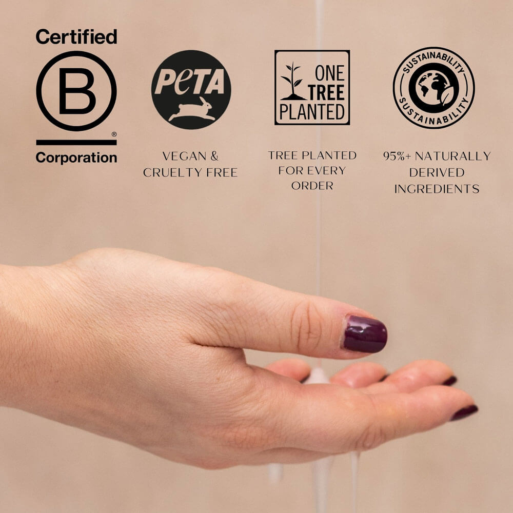 Hand with dark nail polish holding a product, with sustainability and ethical certification logos displayed.