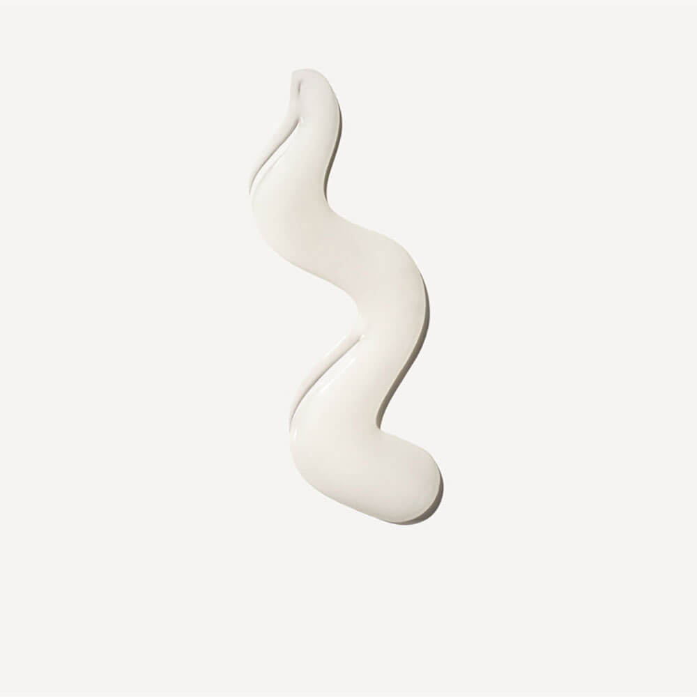 White, wavy ceramic object on a light beige background