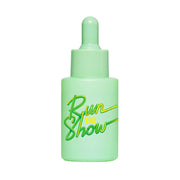 Green dropper bottle with 'Run The Show' text on a light green background